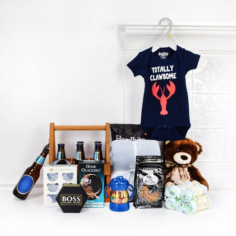 This thoughtful gift set includes a range of items, from adorable baby apparel and blankets to delicious snacks and refreshing beers for the proud parents, Montreal delivery 