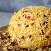 A delicious treat sure to impress cheese lovers, the Tomato Cheese Ball is just what a holiday party needs. Loaded with cream cheese, tomato and cheddar cheese, it’s perfect for a Christmas party or any gathering from Montreal Baskets - Montreal Delivery